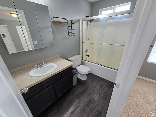 4043 S Lake Vista Dr, Saratoga Springs, UT 84045 - full bathroom with toilet, vanity, bath / shower combo with glass door, and wood finished floors