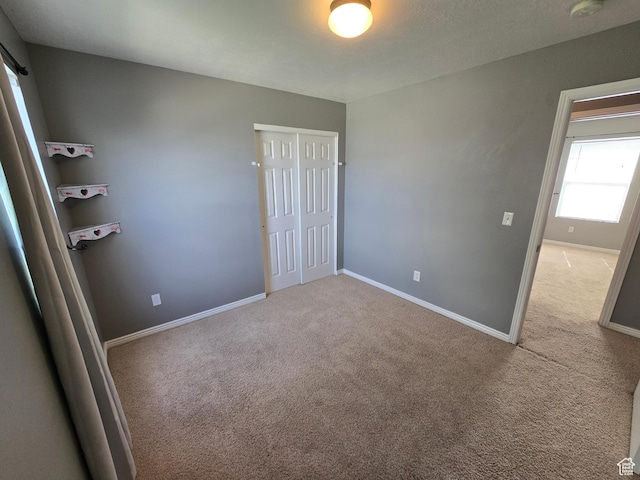 4043 S Lake Vista Dr, Saratoga Springs, UT 84045 - unfurnished bedroom featuring carpet floors, baseboards, and a closet