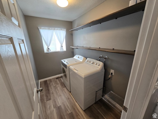 4043 S Lake Vista Dr, Saratoga Springs, UT 84045 - laundry room featuring separate washer and dryer, wood finished floors, and baseboards