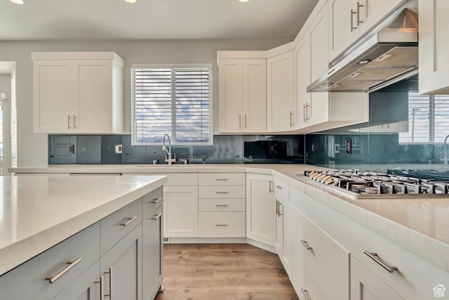 3727 N 900 W, Lehi, UT 84043 - kitchen featuring under cabinet range hood, stainless steel gas cooktop, recessed lighting, a sink, and healthy amount of natural light