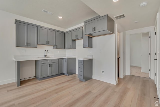 3727 N 900 W, Lehi, UT 84043 - kitchen featuring a sink, gray cabinets, baseboards, light wood-type flooring, and recessed lighting
