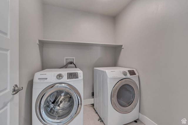 3727 N 900 W, Lehi, UT 84043 - laundry area featuring washing machine and dryer, baseboards, and light tile patterned floors