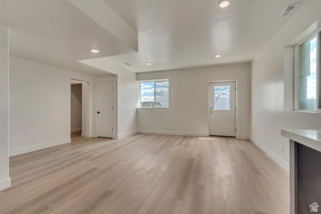3727 N 900 W, Lehi, UT 84043 - unfurnished living room featuring light wood-style floors, baseboards, and recessed lighting