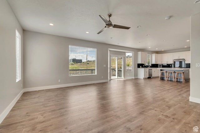 3727 N 900 W, Lehi, UT 84043 - unfurnished living room with light wood-style floors, baseboards, recessed lighting, and a ceiling fan