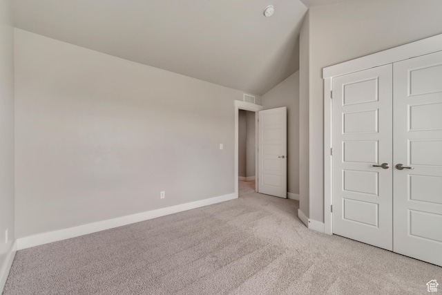 3727 N 900 W, Lehi, UT 84043 - unfurnished bedroom with light colored carpet, lofted ceiling, baseboards, and a closet