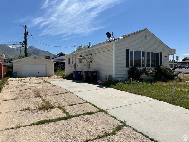 4688 S 200 E, Washington Terrace, UT 84405 - view of side of home featuring a garage and an outdoor structure