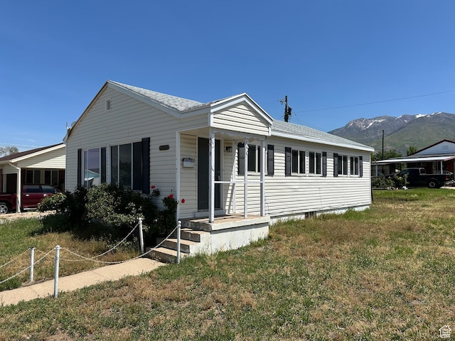 4688 S 200 E, Washington Terrace, UT 84405 - view of front of house with a mountain view and a front lawn