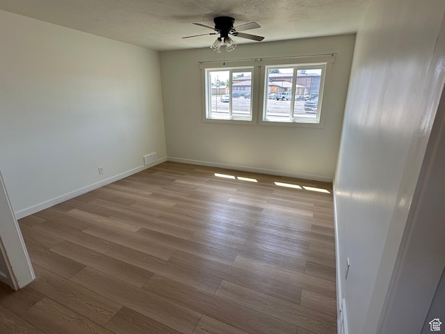 4688 S 200 E, Washington Terrace, UT 84405 - empty room with a ceiling fan, wood finished floors, baseboards, and a textured ceiling