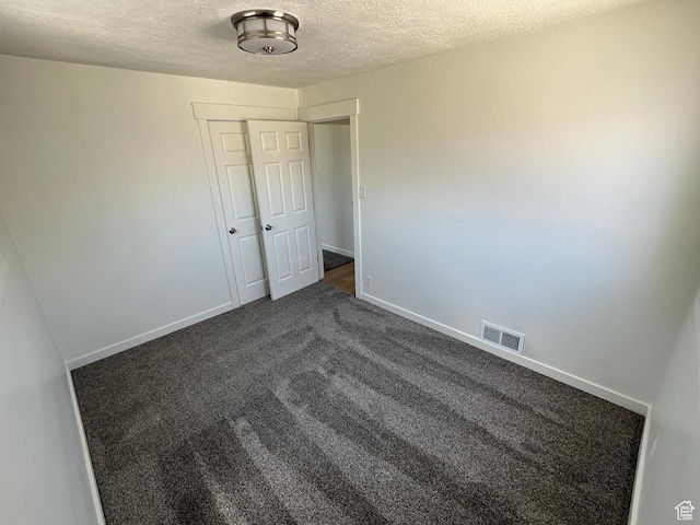4688 S 200 E, Washington Terrace, UT 84405 - spare room featuring a textured ceiling, dark carpet, and baseboards