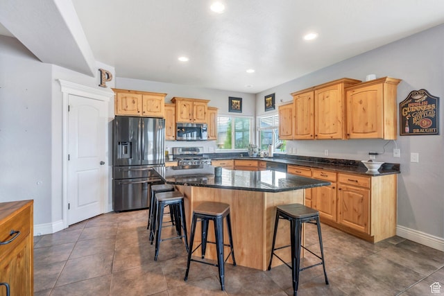 414 W Kit Fox Dr, Saratoga Springs, UT 84045 - kitchen featuring appliances with stainless steel finishes, a breakfast bar, baseboards, recessed lighting, and a center island