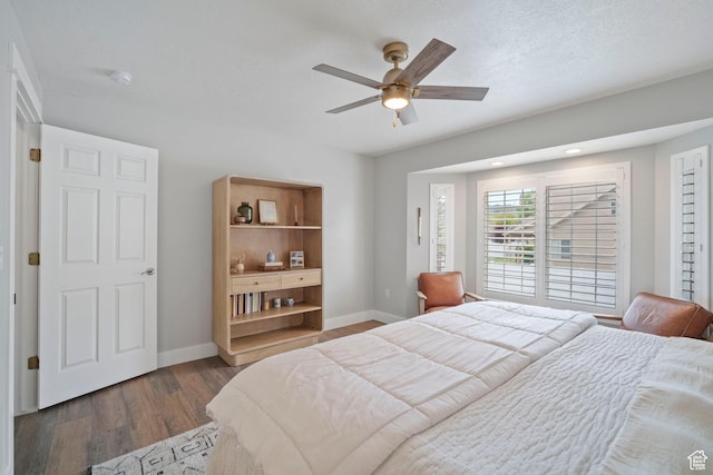 890 E 20 N, Smithfield, UT 84335 - bedroom with baseboards, dark wood finished floors, and ceiling fan