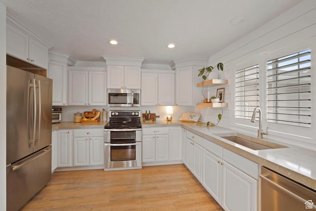 890 E 20 N, Smithfield, UT 84335 - kitchen with appliances with stainless steel finishes, a sink, light countertops, white cabinetry, and recessed lighting