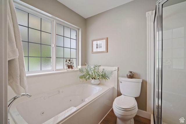 890 E 20 N, Smithfield, UT 84335 - bathroom with toilet, a whirlpool tub, wood finished floors, a shower stall, and baseboards