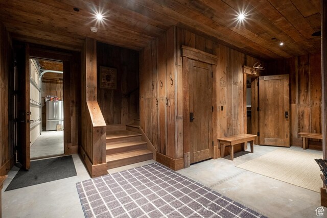 11042 E Wild Elk Mdw, Heber City, UT 84032 - basement featuring wooden ceiling, wood walls, water heater, and stairway