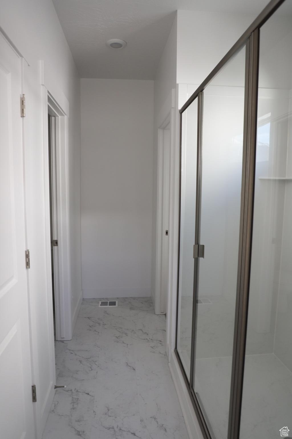 1905 E 1420 N, Spanish Fork, UT 84660 - hallway featuring light marble finish flooring and baseboards