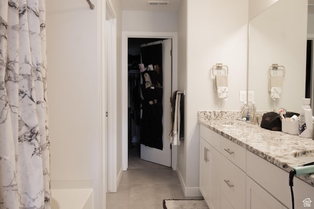 3717 S 3250 W Unit E33, West Haven, UT 84401 - full bath featuring double vanity, tile patterned floors, a spacious closet, shower / tub combo, and baseboards