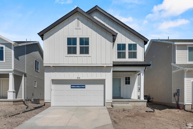 7848 W Alluvial Dr Unit 478, Magna, UT 84044 - view of front of property with board and batten siding, driveway, a garage, and central AC unit