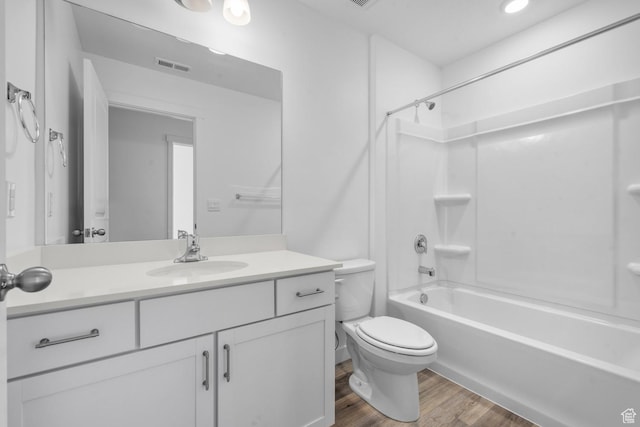 7848 W Alluvial Dr Unit 478, Magna, UT 84044 - bathroom with toilet, vanity, wood finished floors, and washtub / shower combination