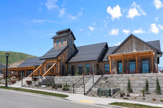 7848 W Alluvial Dr Unit 478, Magna, UT 84044 - view of front of house featuring stairs, a standing seam roof, board and batten siding, and metal roof