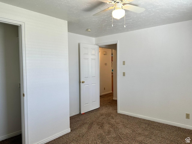 545 E Molen Rd, Ferron, UT 84523 - unfurnished bedroom with dark carpet, baseboards, and ceiling fan