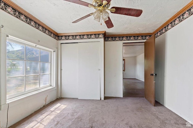 660 S Coleman St, Tooele, UT 84074 - unfurnished bedroom featuring carpet floors, a closet, crown molding, and ceiling fan