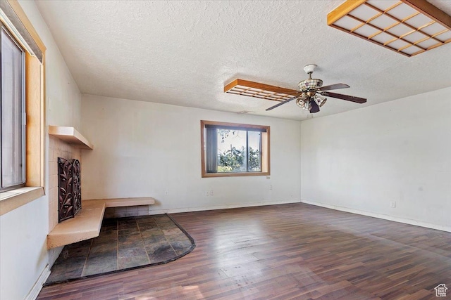 660 S Coleman St, Tooele, UT 84074 - unfurnished living room featuring wood finished floors, a ceiling fan, a textured ceiling, and baseboards