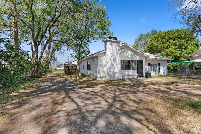 660 S Coleman St, Tooele, UT 84074 - back of house featuring a chimney
