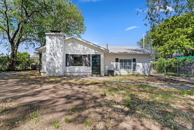660 S Coleman St, Tooele, UT 84074 - rear view of property featuring a chimney and cooling unit