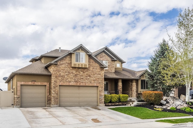 2949 W Hayden Ridge Way, Riverton, UT 84065 - craftsman inspired home with stone siding, concrete driveway, roof with shingles, covered porch, and an attached garage