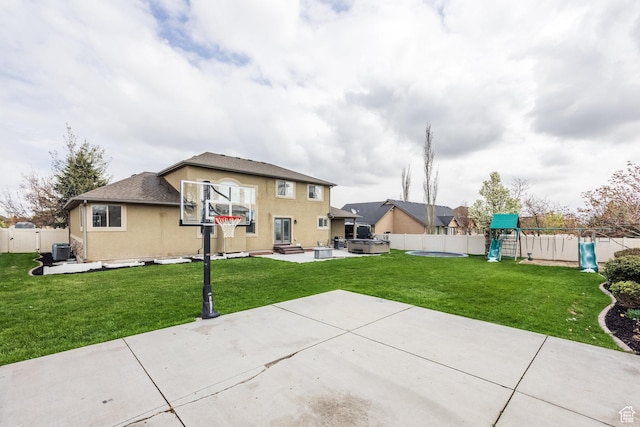 2949 W Hayden Ridge Way, Riverton, UT 84065 - back of property with a playground, a patio area, central air condition unit, a hot tub, and stucco siding
