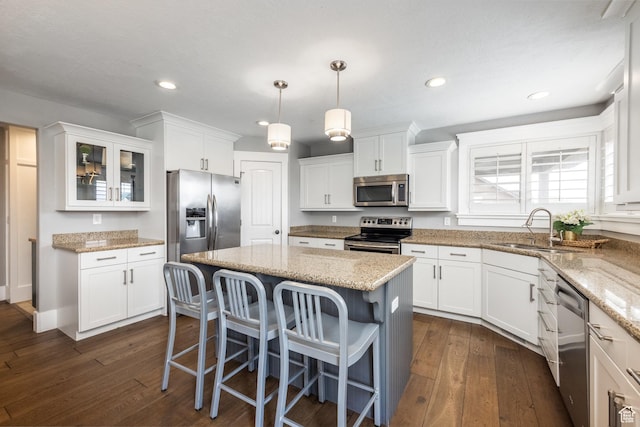 2949 W Hayden Ridge Way, Riverton, UT 84065 - kitchen featuring appliances with stainless steel finishes, a sink, white cabinets, dark wood finished floors, and recessed lighting