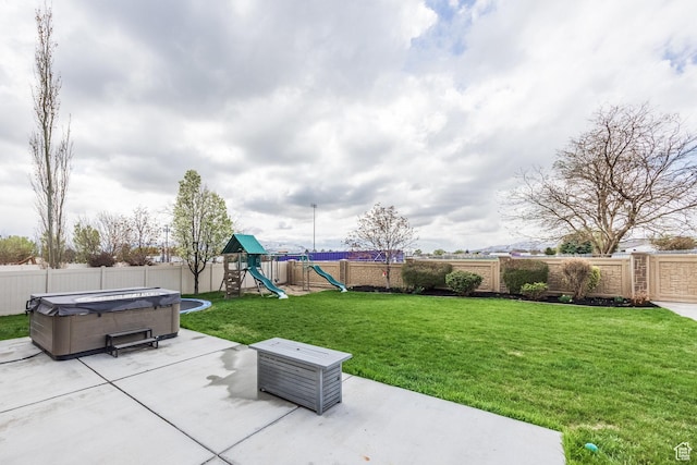 2949 W Hayden Ridge Way, Riverton, UT 84065 - view of patio / terrace with a playground and a hot tub