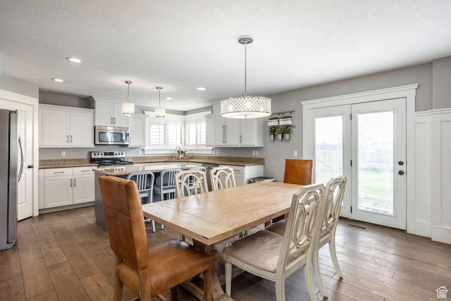 2949 W Hayden Ridge Way, Riverton, UT 84065 - dining room featuring wood-type flooring and recessed lighting