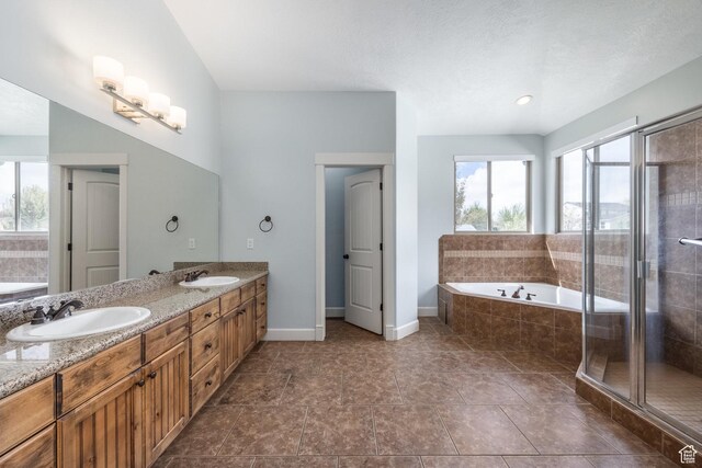 2949 W Hayden Ridge Way, Riverton, UT 84065 - bathroom with a bath, double vanity, a shower stall, and baseboards