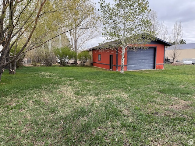 184 N 3rd E, Manila, UT 84046 - view of grassy yard featuring an outdoor structure and a detached garage