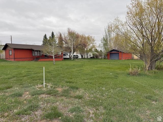 184 N 3rd E, Manila, UT 84046 - view of grassy yard featuring an outbuilding and a garage