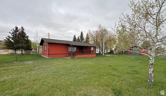 184 N 3rd E, Manila, UT 84046 - rear view of house featuring a lawn