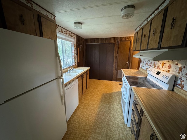 184 N 3rd E, Manila, UT 84046 - kitchen featuring white appliances, a sink, under cabinet range hood, light flooring, and a textured ceiling