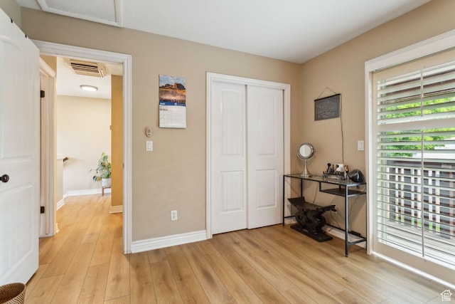 518 E 3955 S, Millcreek, UT 84107 - bedroom featuring light wood-style floors, a closet, and baseboards
