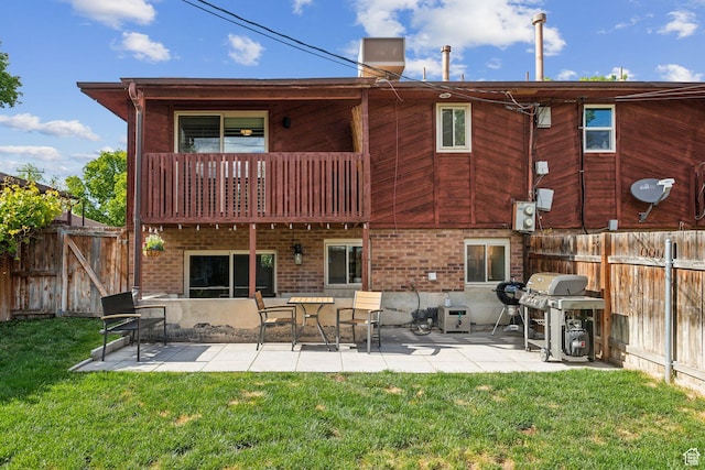 518 E 3955 S, Millcreek, UT 84107 - back of house with a balcony, a patio, and brick siding