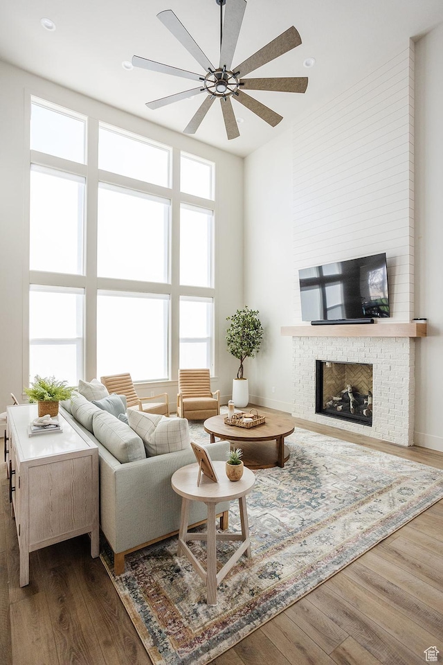778 N 780th St W, American Fork, UT 84003 - living room featuring ceiling fan, dark wood-style floors, a fireplace, and recessed lighting