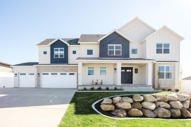 778 N 780th St W, American Fork, UT 84003 - view of front facade with board and batten siding, a standing seam roof, driveway, and a porch