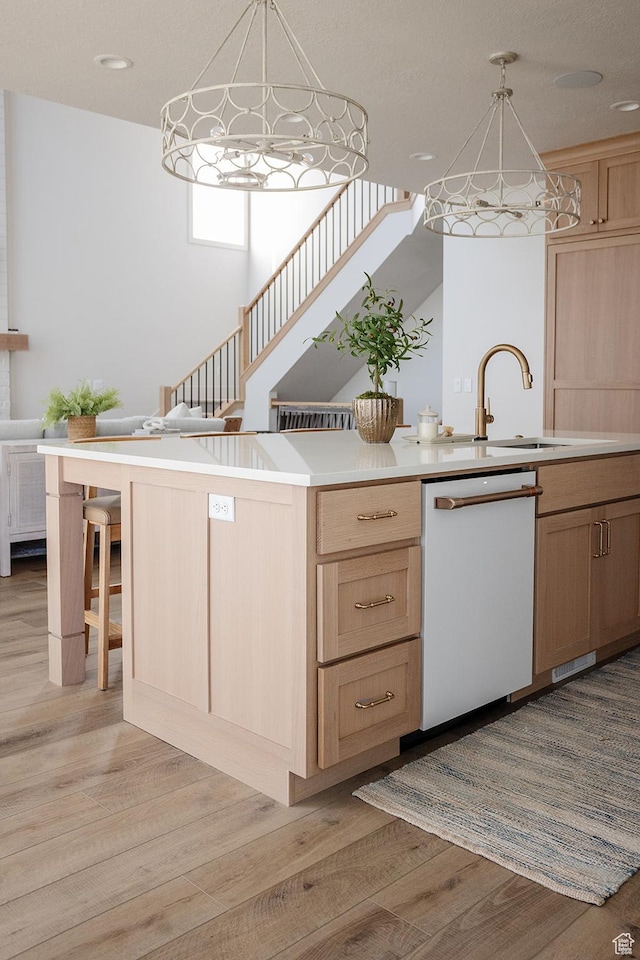 778 N 780th St W, American Fork, UT 84003 - kitchen with dishwasher, light brown cabinetry, light wood finished floors, light countertops, and pendant lighting