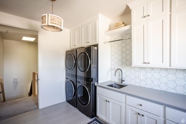 778 N 780th St W, American Fork, UT 84003 - laundry area featuring cabinet space and stacked washer / drying machine