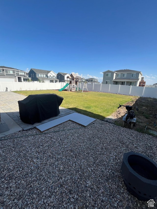 2323 W Thomas Ct, Syracuse, UT 84075 - view of yard featuring a playground, a patio, and a residential view