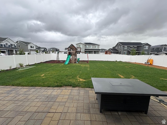 2323 W Thomas Ct, Syracuse, UT 84075 - view of patio with a playground, a residential view, and a hot tub