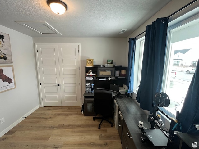 2323 W Thomas Ct, Syracuse, UT 84075 - home office with a textured ceiling, light wood finished floors, baseboards, and attic access