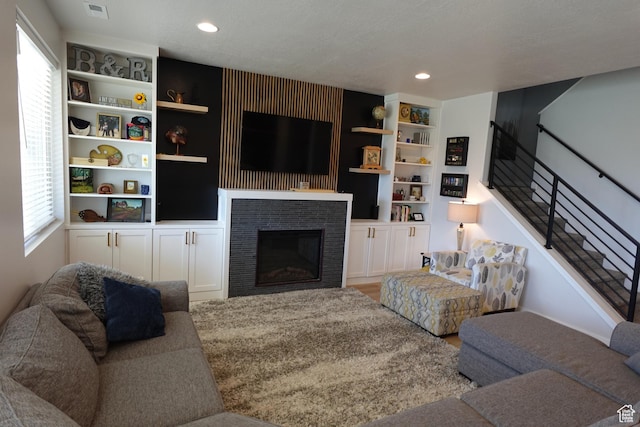 2323 W Thomas Ct, Syracuse, UT 84075 - living area with recessed lighting, a fireplace, wood finished floors, and built in features
