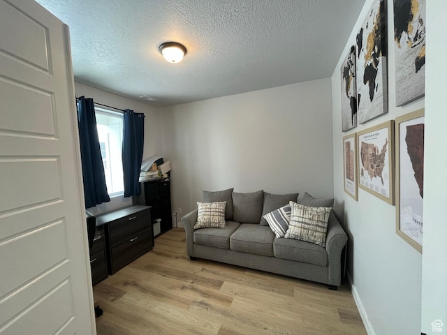 2323 W Thomas Ct, Syracuse, UT 84075 - office area with light wood-type flooring and a textured ceiling