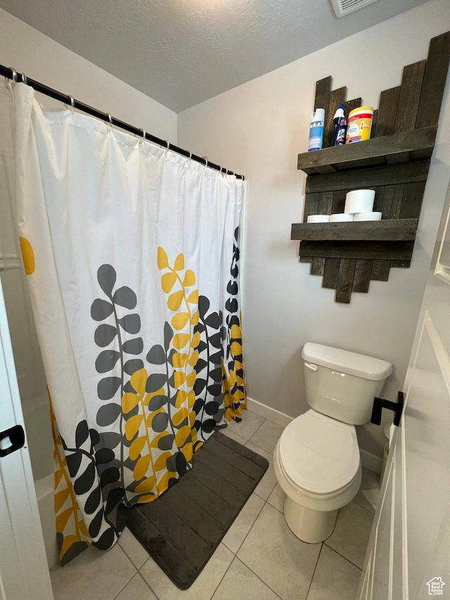 2323 W Thomas Ct, Syracuse, UT 84075 - full bathroom with toilet, tile patterned floors, baseboards, and shower / bathtub combination with curtain